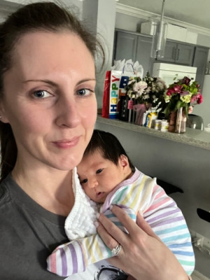 Stacy with Irene (she was about 2 weeks old here and Stacy would go over and stay with Irene for a couple hours a few days a week while Shauna ran errands).