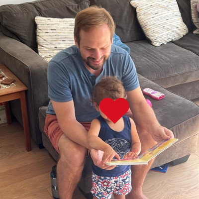 Garret reading to our friend's child