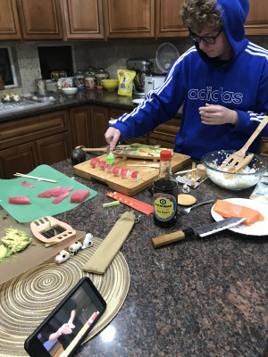 Owen making sushi.