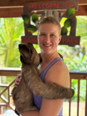 Krista with Cardi the sloth in Roatan