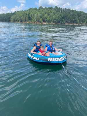 David drives the boat and takes all the kids tubing! 