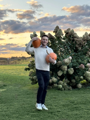 Jamie picking pumpkins for Halloween.  
