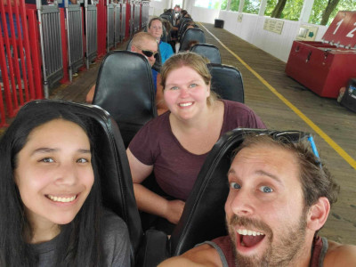 Riding a roller coaster with Terri's little through the Big Brothers Big Sisters program.