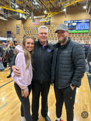 Us with Nates Dad after one of his state basketball games for the high school he coaches!