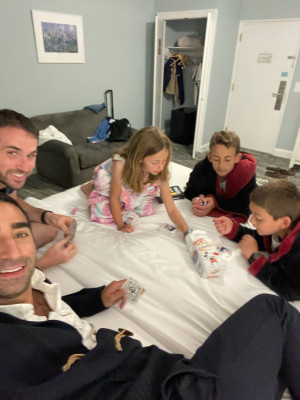 Zac & Jesse playing cards and eating snacks with our niece and nephews.