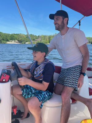 Jesse teaching our nephew how to drive a boat.