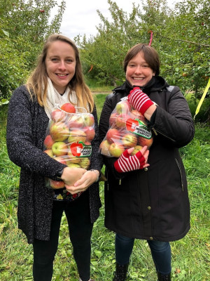 Sophia and her sister apple-picking