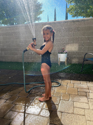 Hot summer days call for playing with the hose!