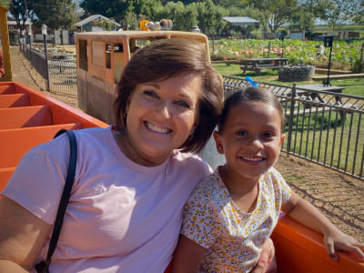Riding the train with Grandma at the pumpkin patch!