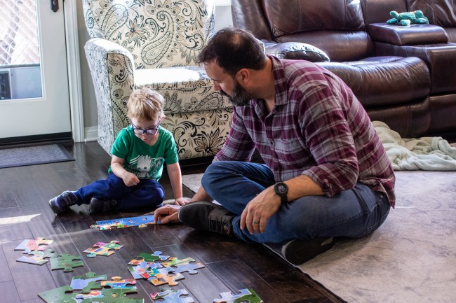 Ben and Lucas working on a puzzle