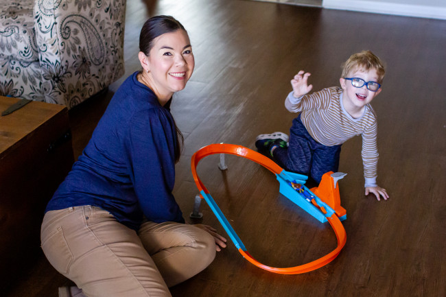 Paulina and Lucas love playing with the Hot Wheels tracks. 